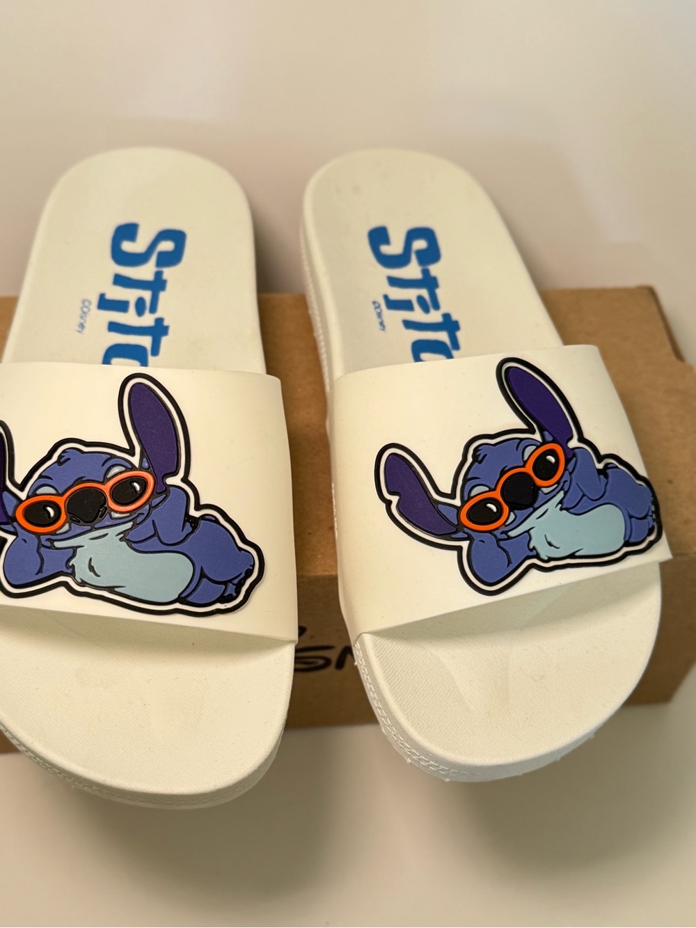 Disney White Slides with Blue and Purple Stitch Graphic and Orange Sunglasses